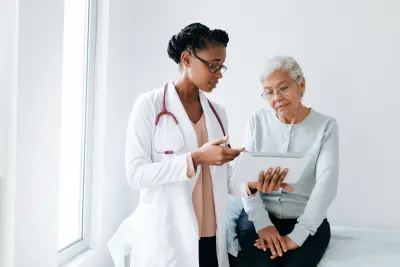 A medical practitioner discusses results with a patient.