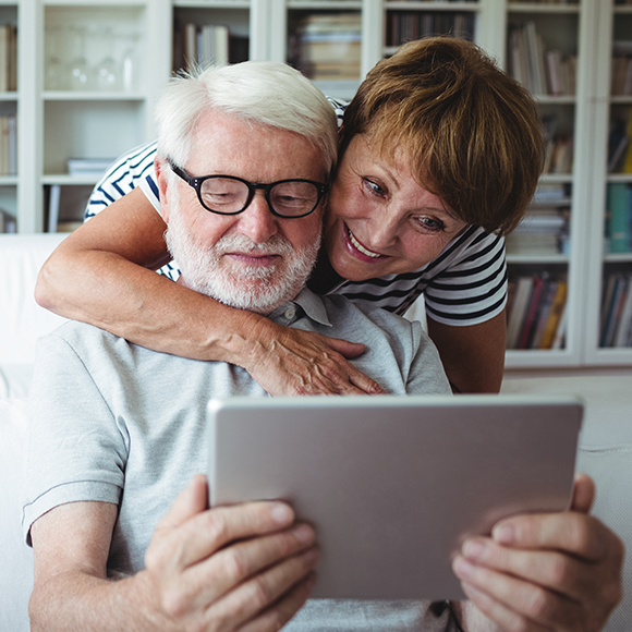 Older couple looking at tablet