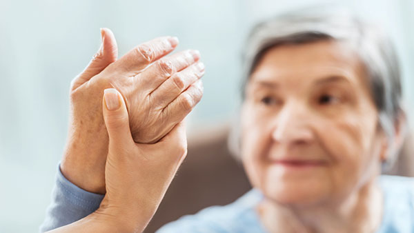 A senior woman receiving physical therapy.