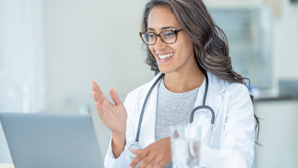 Young female doctor doing online consultations