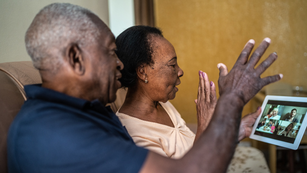 Senior couple on a video calling using a digital tablet at home