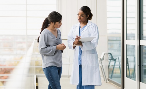 A young woman consults with her doctor